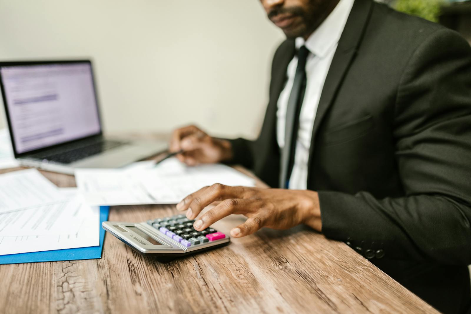 Syed Accounting adviser reviewing a calculation with a client